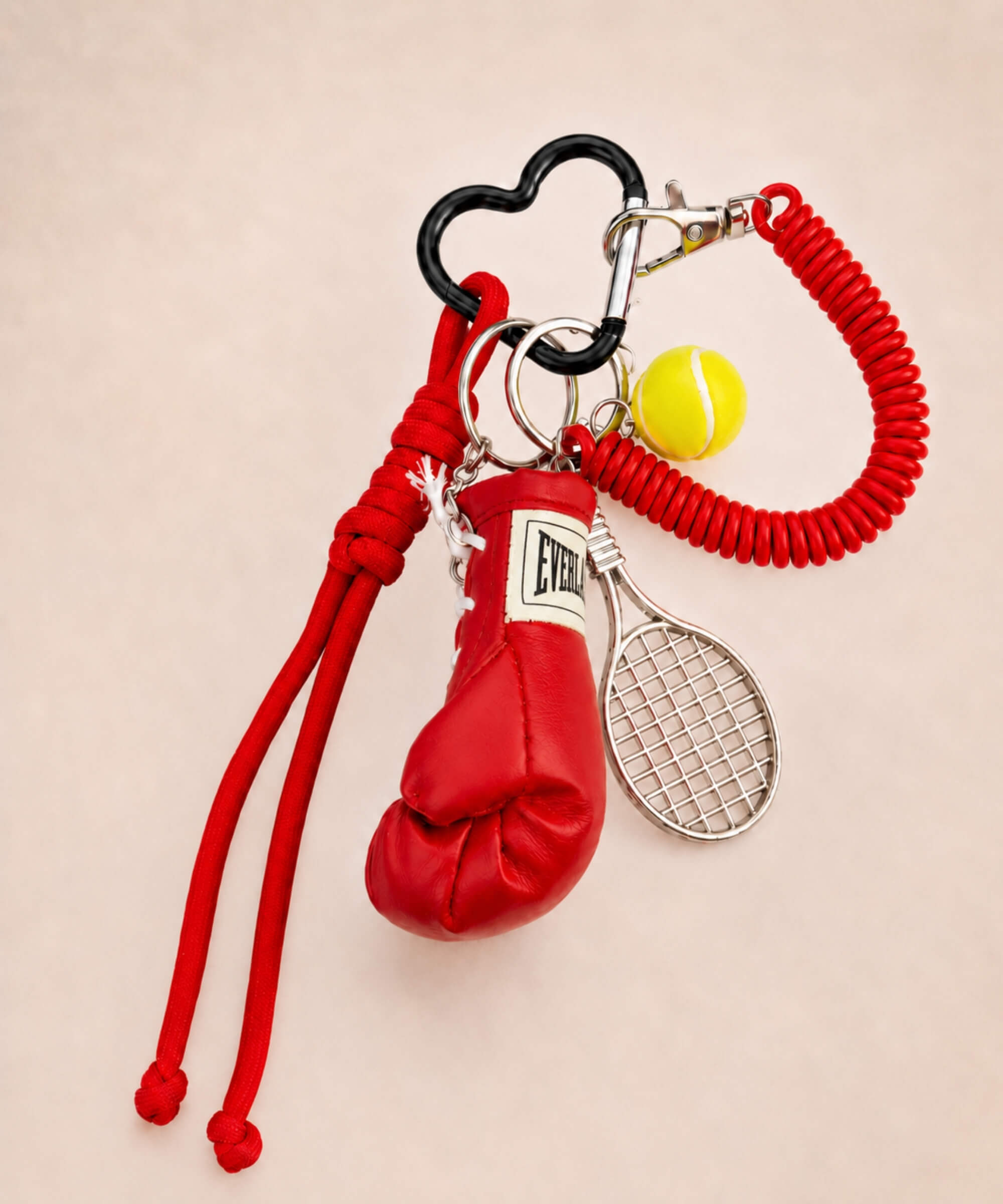 Red boxing glove and tennis rope keychain with tennis racket and yellow ball charm